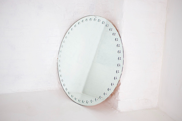 Large Fornasetti style optical mirror.