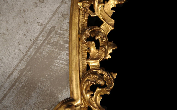  18th century Italian baroque mirror, gilded wood leaf