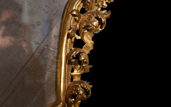  18th century Italian baroque mirror, gilded wood leaf