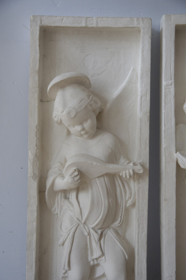 FRENCH school of the 20th century after DONATELLO (1386-1466), suite of two plaster bas-reliefs.