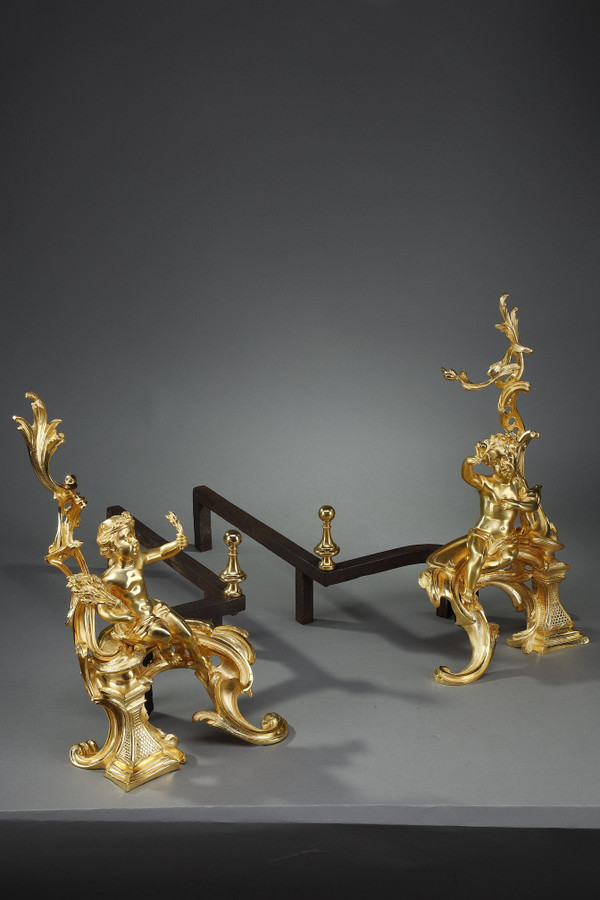 PAIR OF GILDED ANDIRONS IN THE LOUIS XV STYLE BRONZE