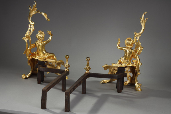 PAIR OF GILDED ANDIRONS IN THE LOUIS XV STYLE BRONZE