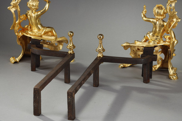 PAIR OF GILDED ANDIRONS IN THE LOUIS XV STYLE BRONZE