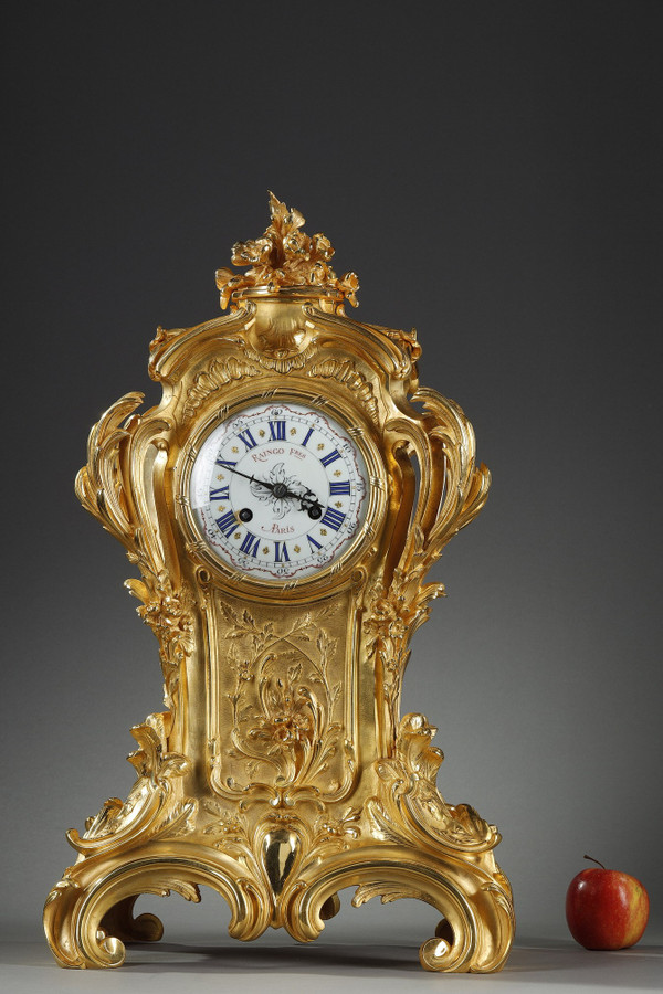 ORMOLU AND CHASED BRONZE ROCAILLE CLOCK, RAINGO AND BROTHERS 