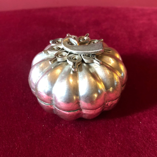 Two foreign silver pumpkins