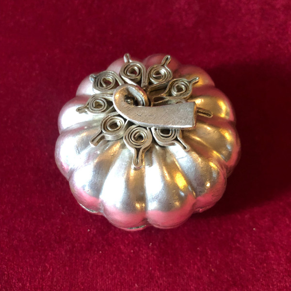 Two foreign silver pumpkins