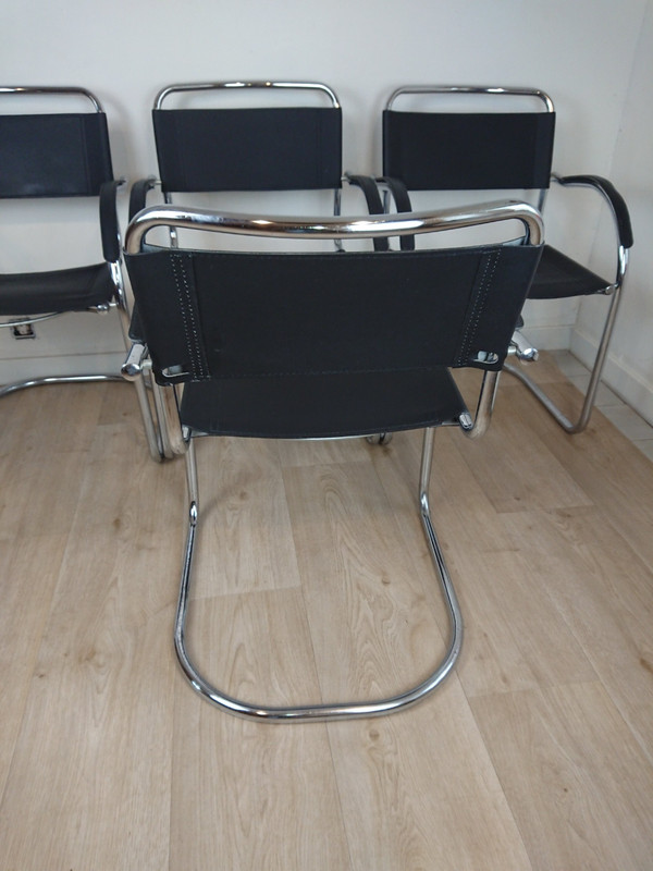 Cantilever tubular steel chairs and armchairs