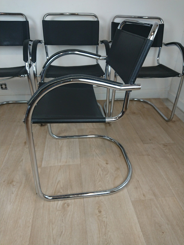 Cantilever tubular steel chairs and armchairs