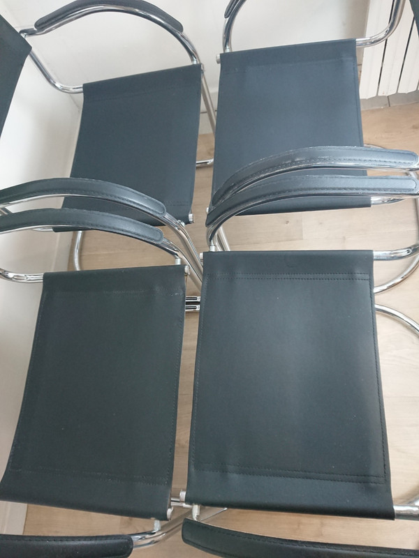 Cantilever tubular steel chairs and armchairs