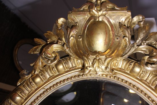 Antique Napoleon III oval mirror in gilded Louis XV style