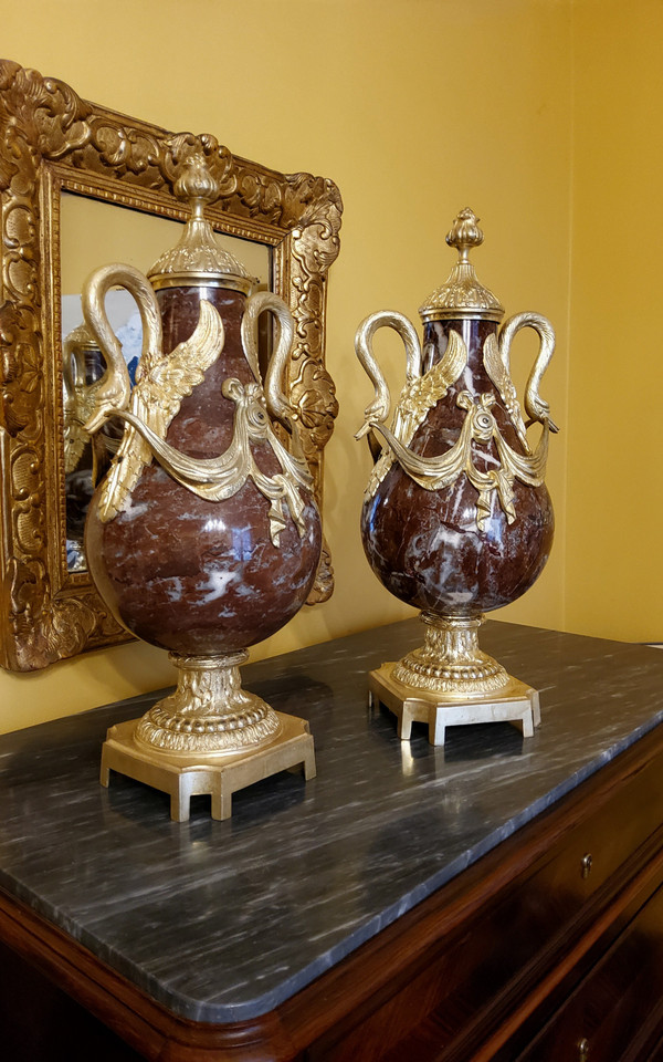 Pair of Red Marble Vases with gilded bronzes and swans in the Louis XVI style, late 19th century.