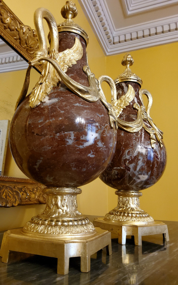 Pair of Red Marble Vases with gilded bronzes and swans in the Louis XVI style, late 19th century.