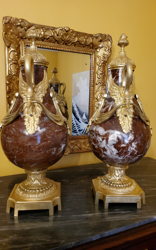 Pair of Red Marble Vases with gilded bronzes and swans in the Louis XVI style, late 19th century.