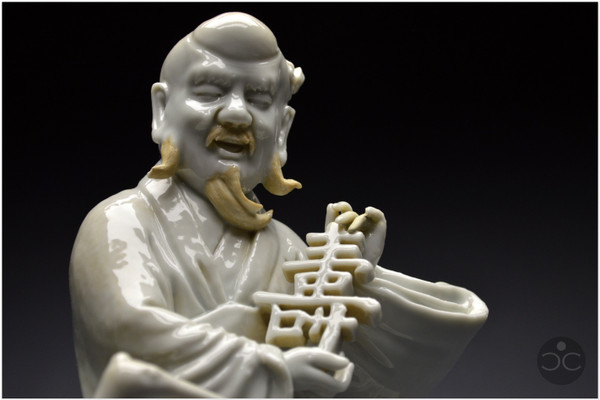 China, 18th century, Chinese white porcelain group depicting the Taoist god Shoulao