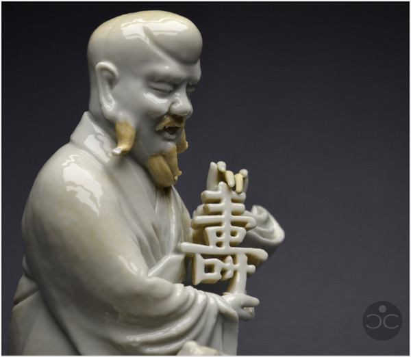 China, 18th century, Chinese white porcelain group depicting the Taoist god Shoulao