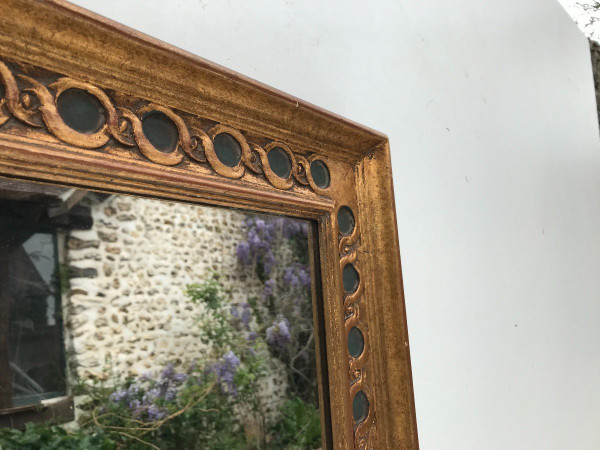 Rectangular mirror in gilded wood.