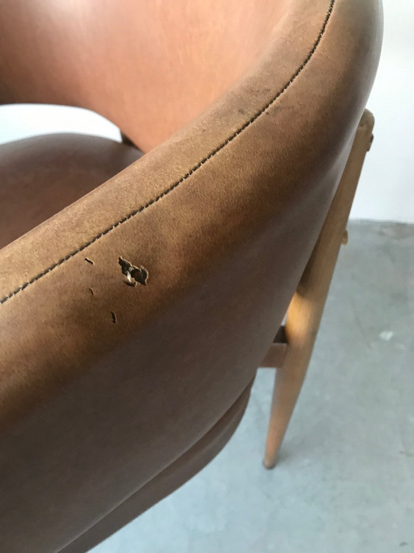 Brown leatherette armchair circa 1950.