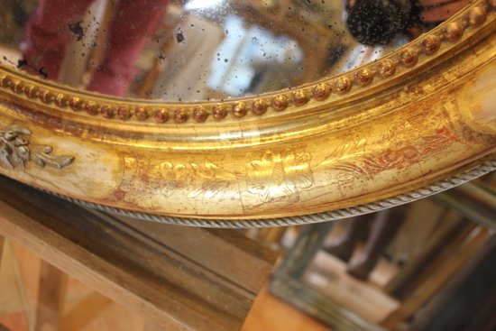 Miroir ancien ovale restauration feuille d'or et patine