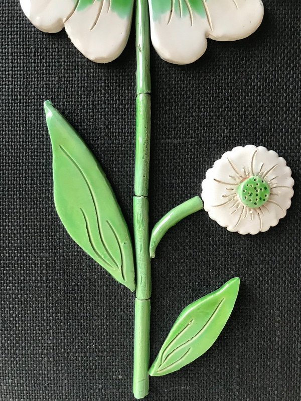 Ceramic flower mirror.