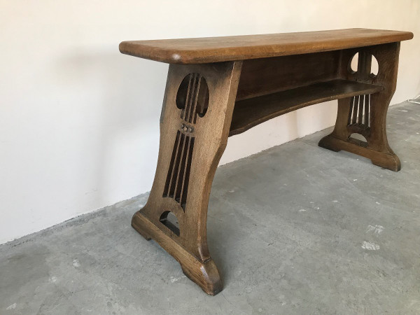 Art and Crafts style organ bench in solid oak.