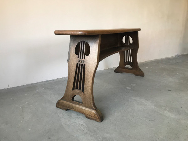 Art and Crafts style organ bench in solid oak.