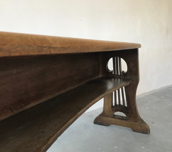 Art and Crafts style organ bench in solid oak.