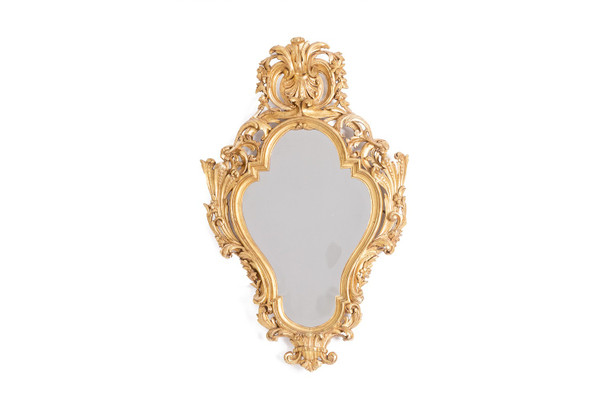 Regency style mirror in carved and gilded wood. 1950s.