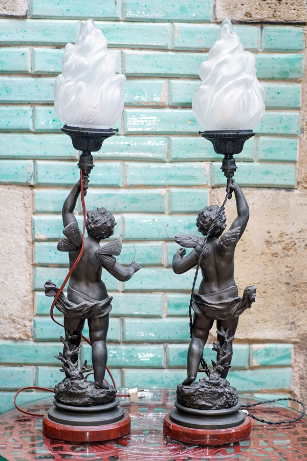 ANGELS, "CHARMER" and "VAINQUEUR", by Ernest RANCOULET, pair of flame lamps, regulates