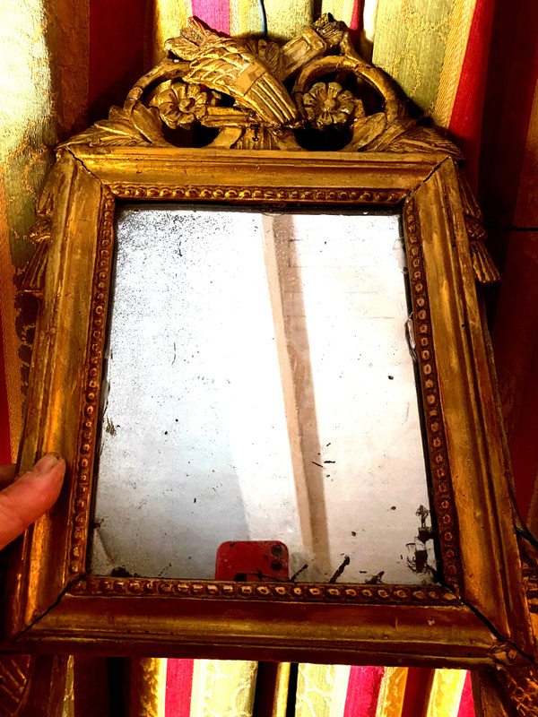 Charming Louis XVI gilded wood mirror with wheat sheaf and quiver, 18th century