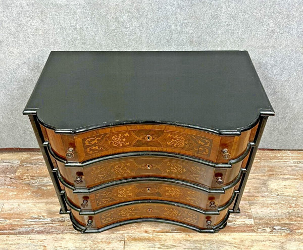 Baroque Louis XV period chest of drawers in blackened wood and marquetry circa 1750