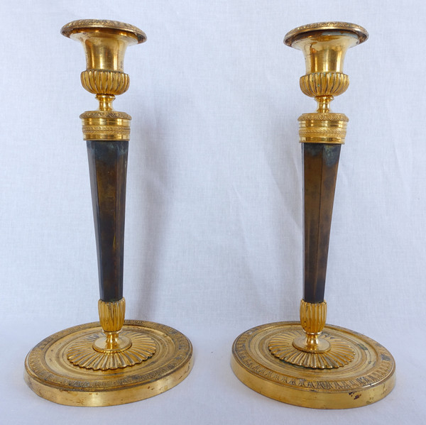 Pair of Empire gilt and patinated bronze candlesticks by Ravrio, early 19th century