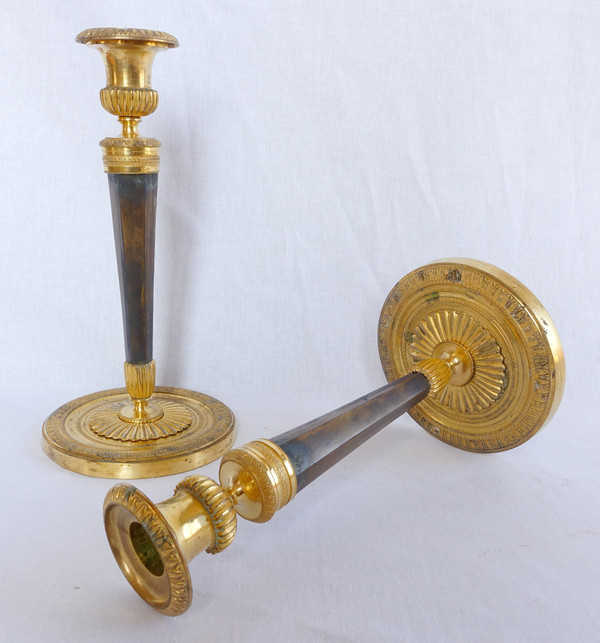 Pair of Empire gilt and patinated bronze candlesticks by Ravrio, early 19th century