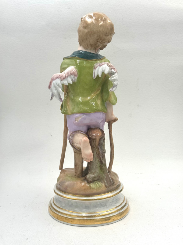 Meissen, figure en porcelaine Cupidon en mendiant 