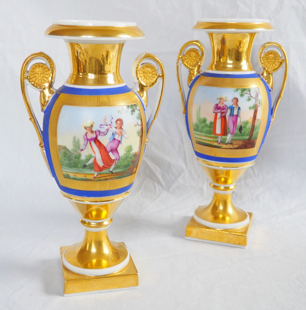 Pair of Empire period vases in Paris porcelain and biscuit, blue and gold polychrome decoration