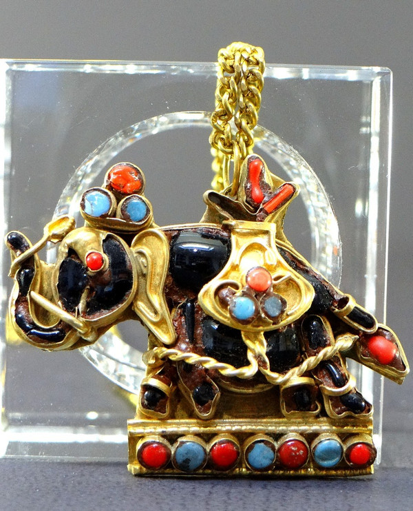 Tibet, Mid-Twentieth Century, Gilded Brass Pendant Embellished with a Representation of an Elephant.