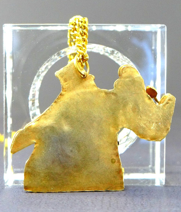 Tibet, Mid-Twentieth Century, Gilded Brass Pendant Embellished with a Representation of an Elephant.