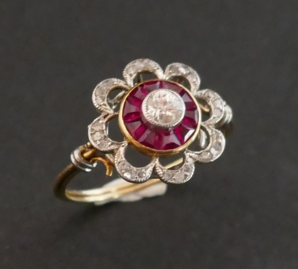 Ring Decorated With A Diamond, Surrounded By Calibrated Rubies.