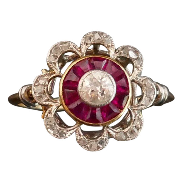 Ring Decorated With A Diamond, Surrounded By Calibrated Rubies.