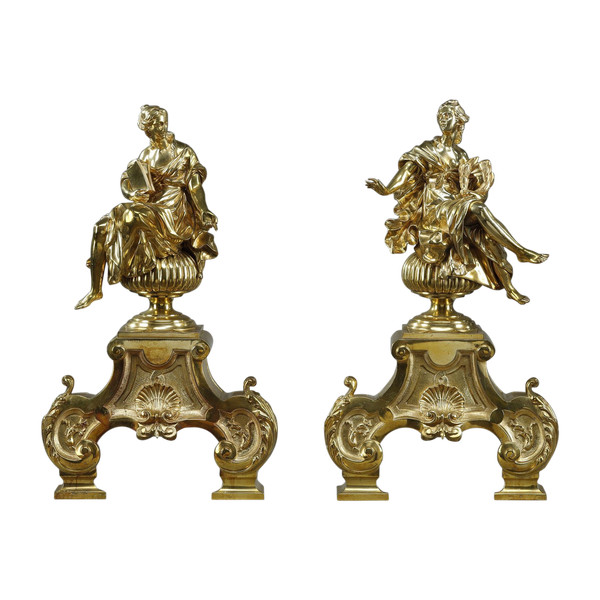 PAIR OF ORMOLU AND CHASED ANDIRONS DECORATED WITH SEATED MUSES