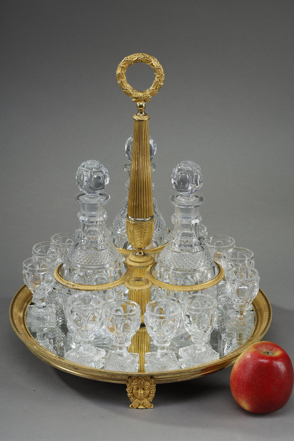 CHARLES X PERIOD LIQUOR SERVICE IN GILT BRONZE AND CUT CRYSTAL