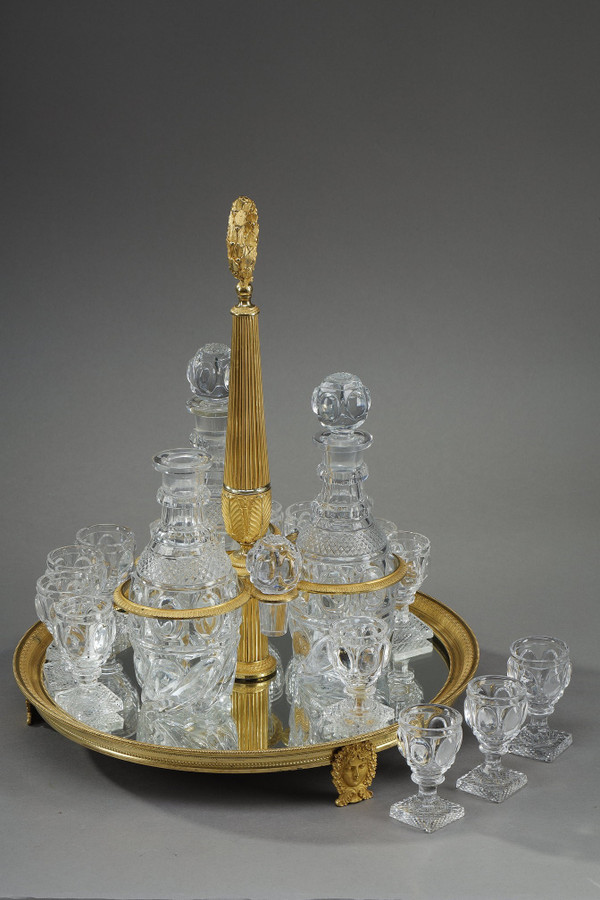 CHARLES X PERIOD LIQUOR SERVICE IN GILT BRONZE AND CUT CRYSTAL