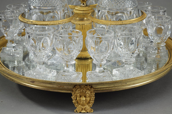 CHARLES X PERIOD LIQUOR SERVICE IN GILT BRONZE AND CUT CRYSTAL