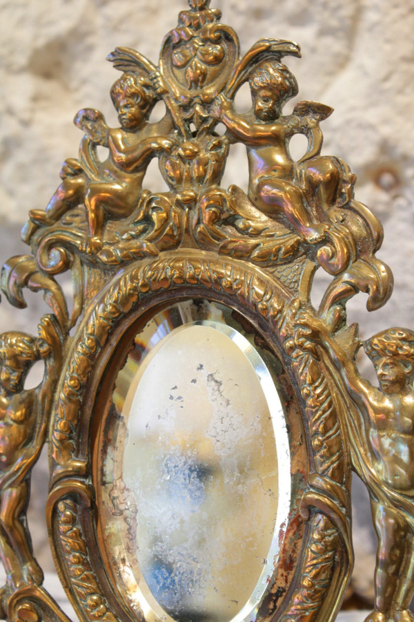 Miroir en bronze à décor d'angelots et mascarons fin 19ème siècle