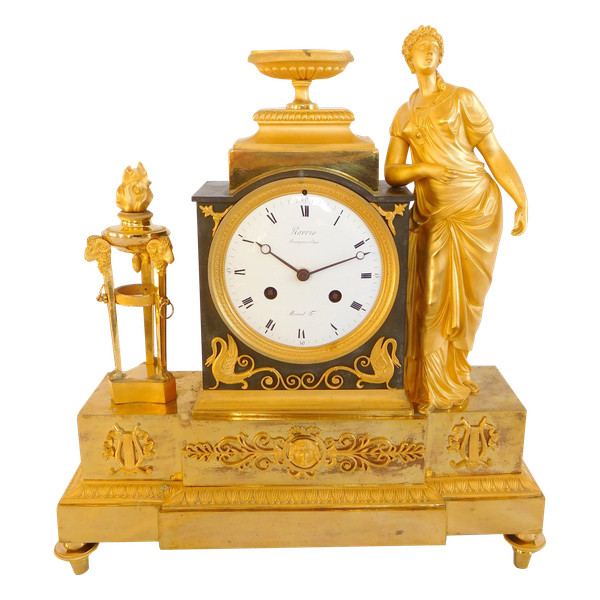 Ravrio: Empire period clock in patinated bronze with mercury gilding - signed