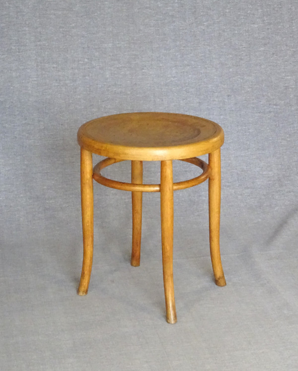 Low blond bistro stool, circa 1920, wooden seat