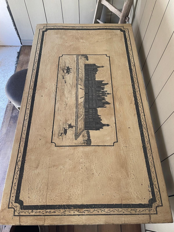 Patinated table with castle motif and hunting scene from the 18th century