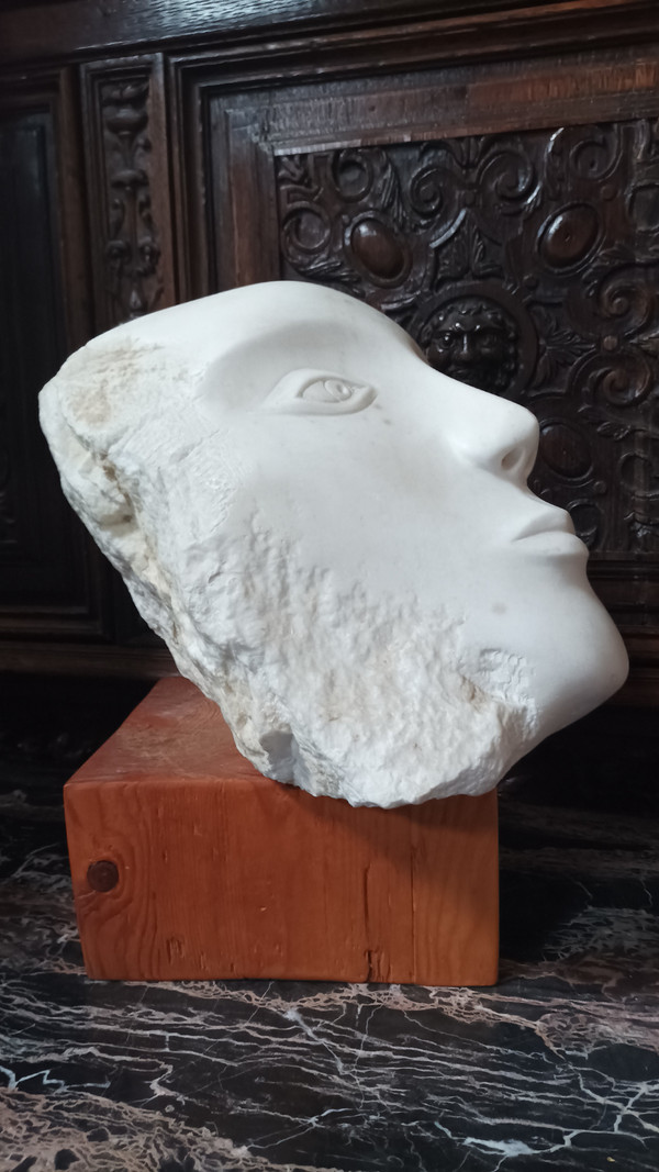 Face bust stone sculpture