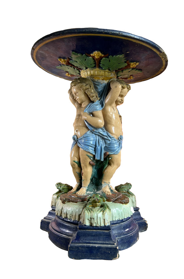 Centerpiece decorative tray decorated with putti in slip