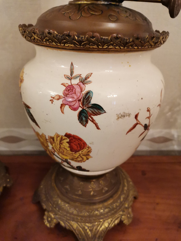 Pair of earthenware oil lamps with pink flower decoration, 19th century