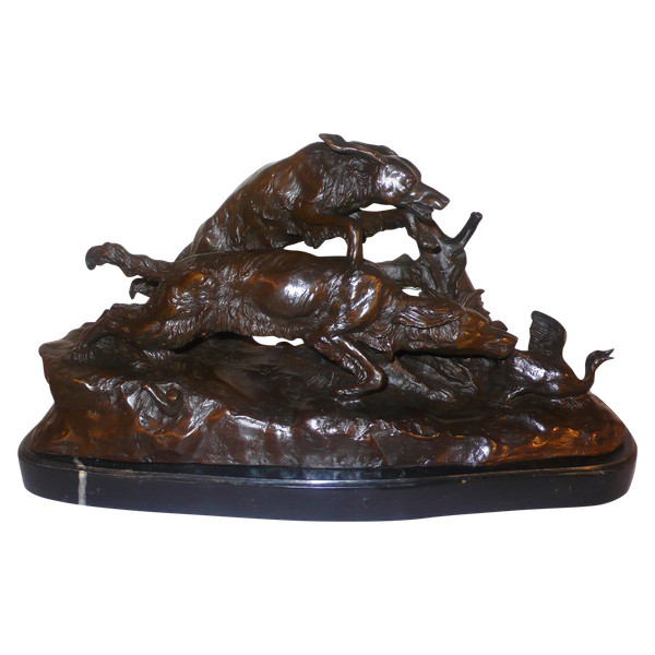 Bronze representing two hunting dogs and a duck.